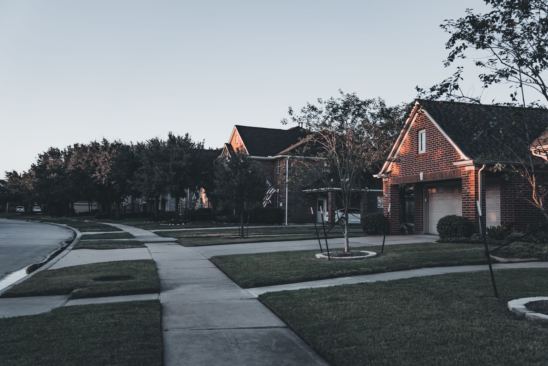 A suburban street lined with homes.